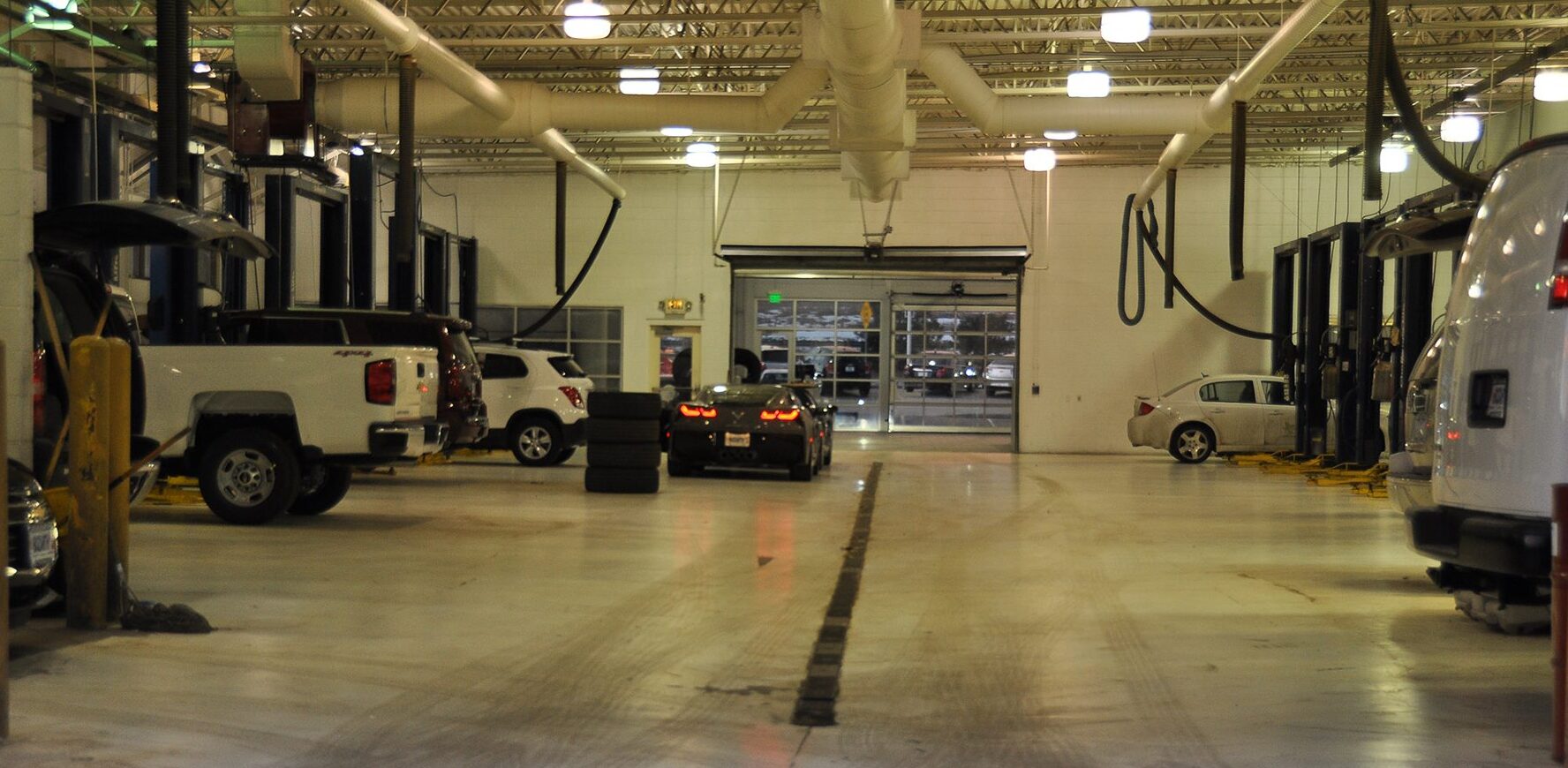 Service bay seven cars inside being serviced inside the Ed Bozarth Chevrolet, Park Meadows