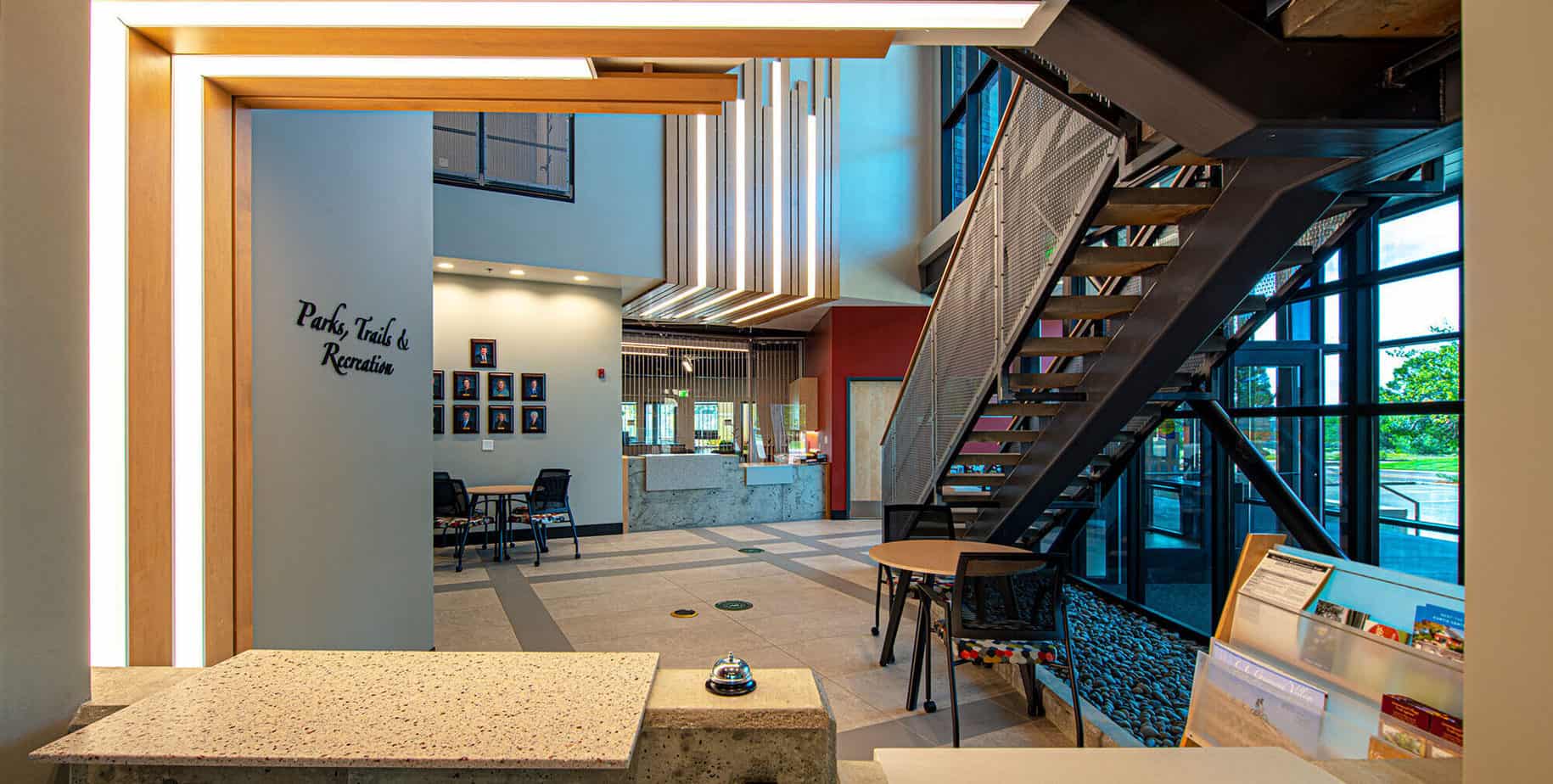 The perspective from behind the reception desk of the Parks, Trails, and Recreation office looking into the lobby