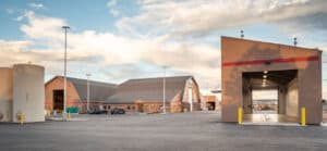 Ground view of the E-470 Support Site. The Salt Barns, Wash Bay, and Large Vehicle Storage Building are in view.