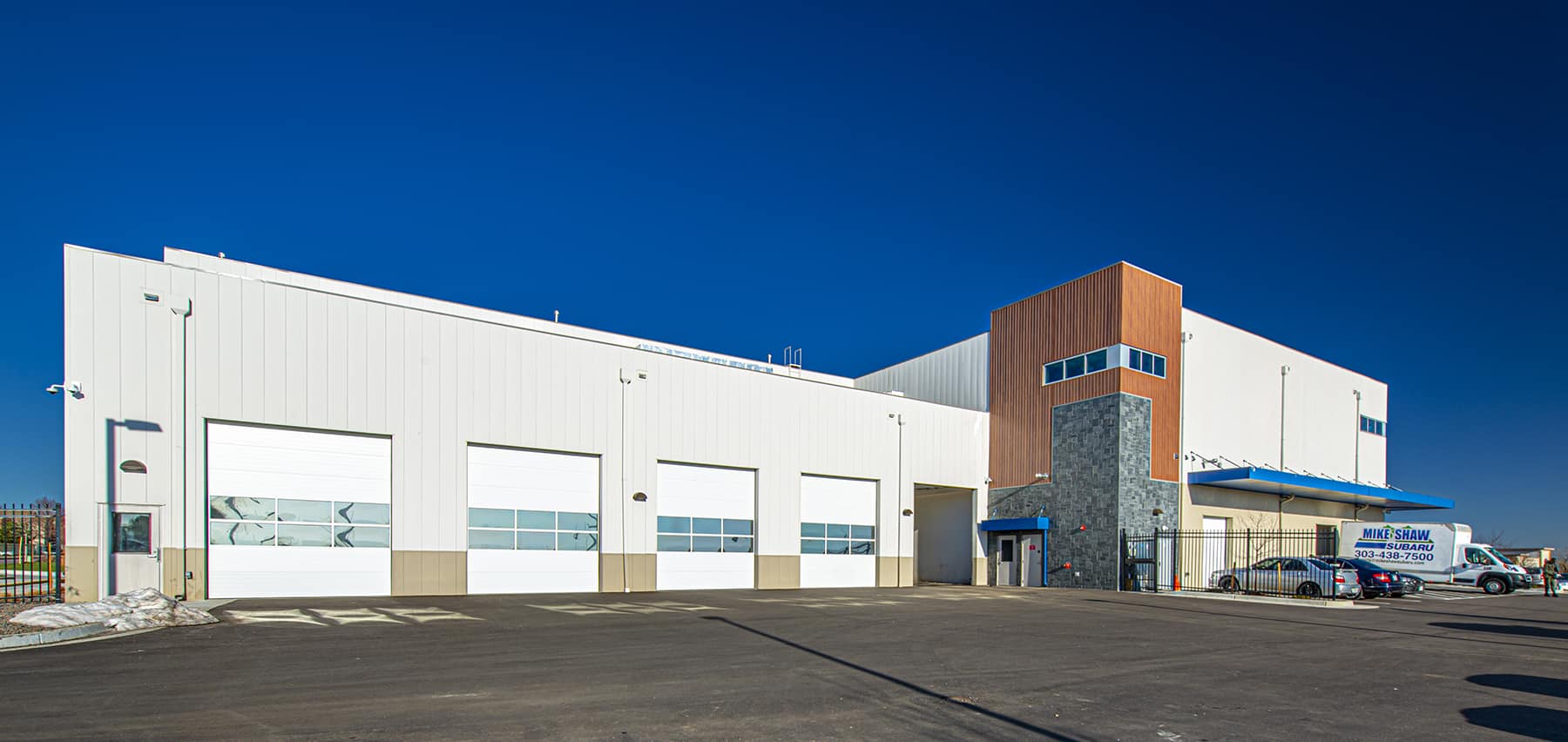 A wide shot of the entrance and the addition to Mike Shaw Subaru Service Center.