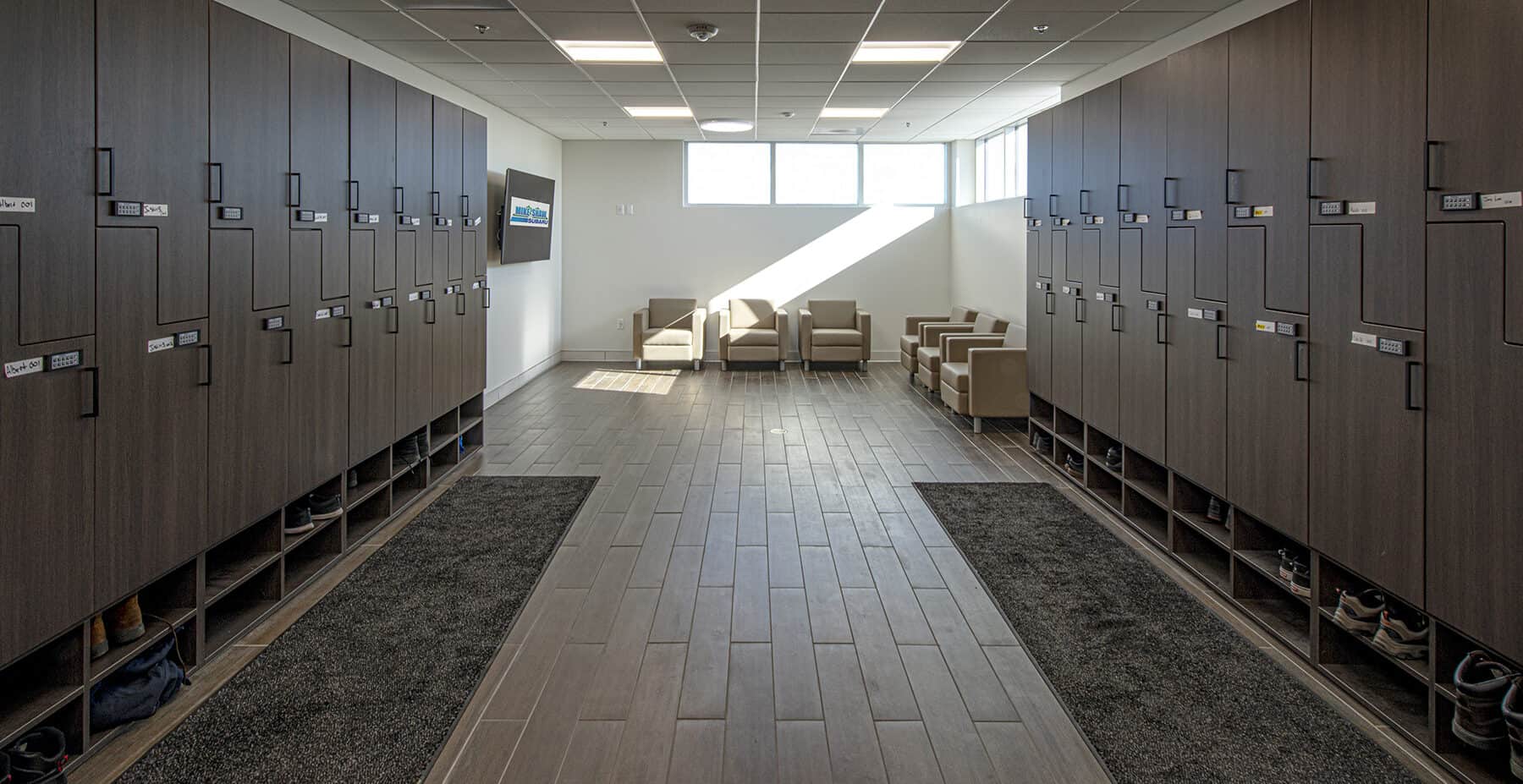 The locker room and breakroom with comfortable chairs and a TV for the staff of Mike Shaw Subaru Service Center.