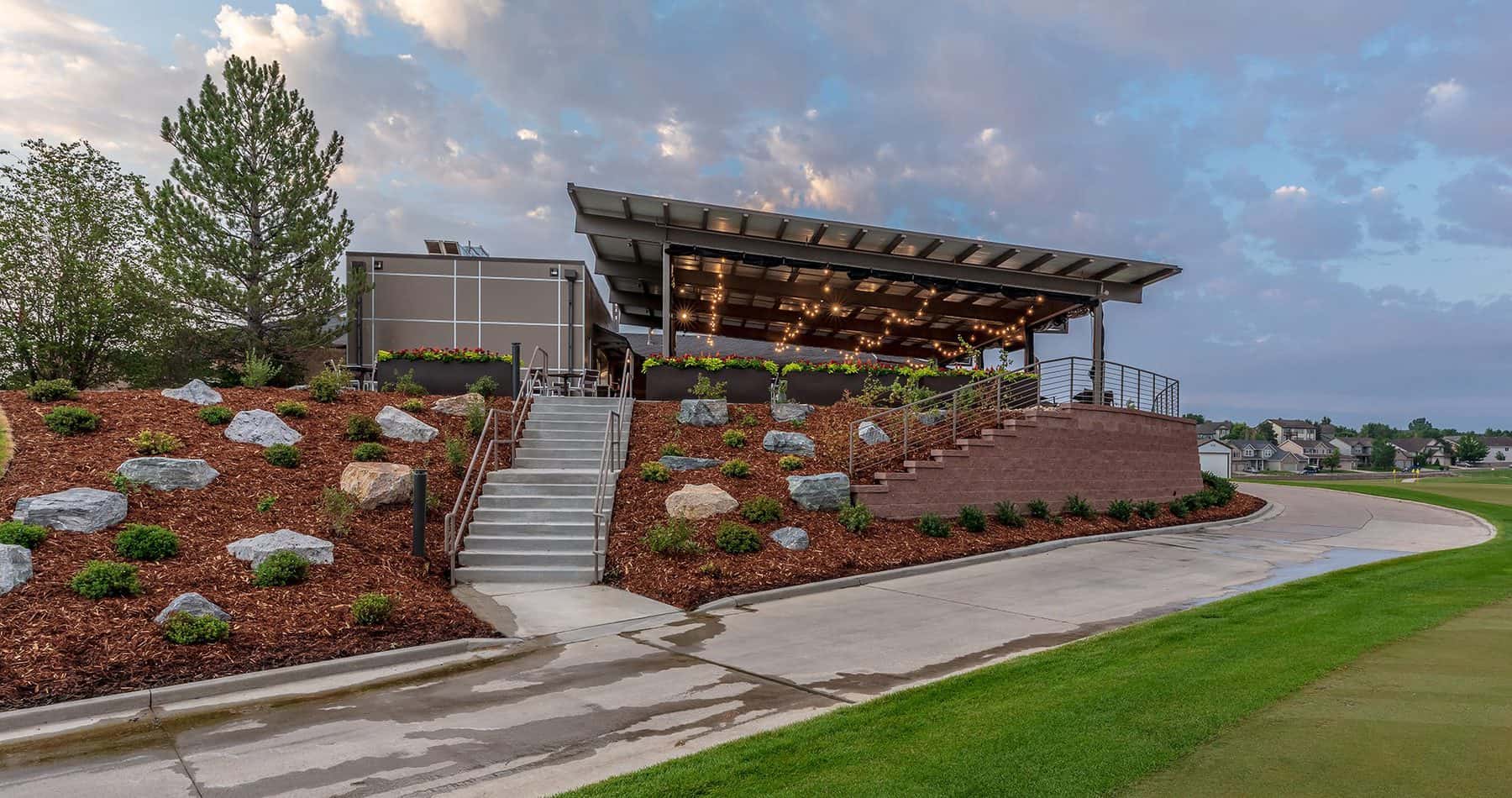 Thorncreek Golf Clubhouse patio at dusk. Designed by D2C Architects Inc