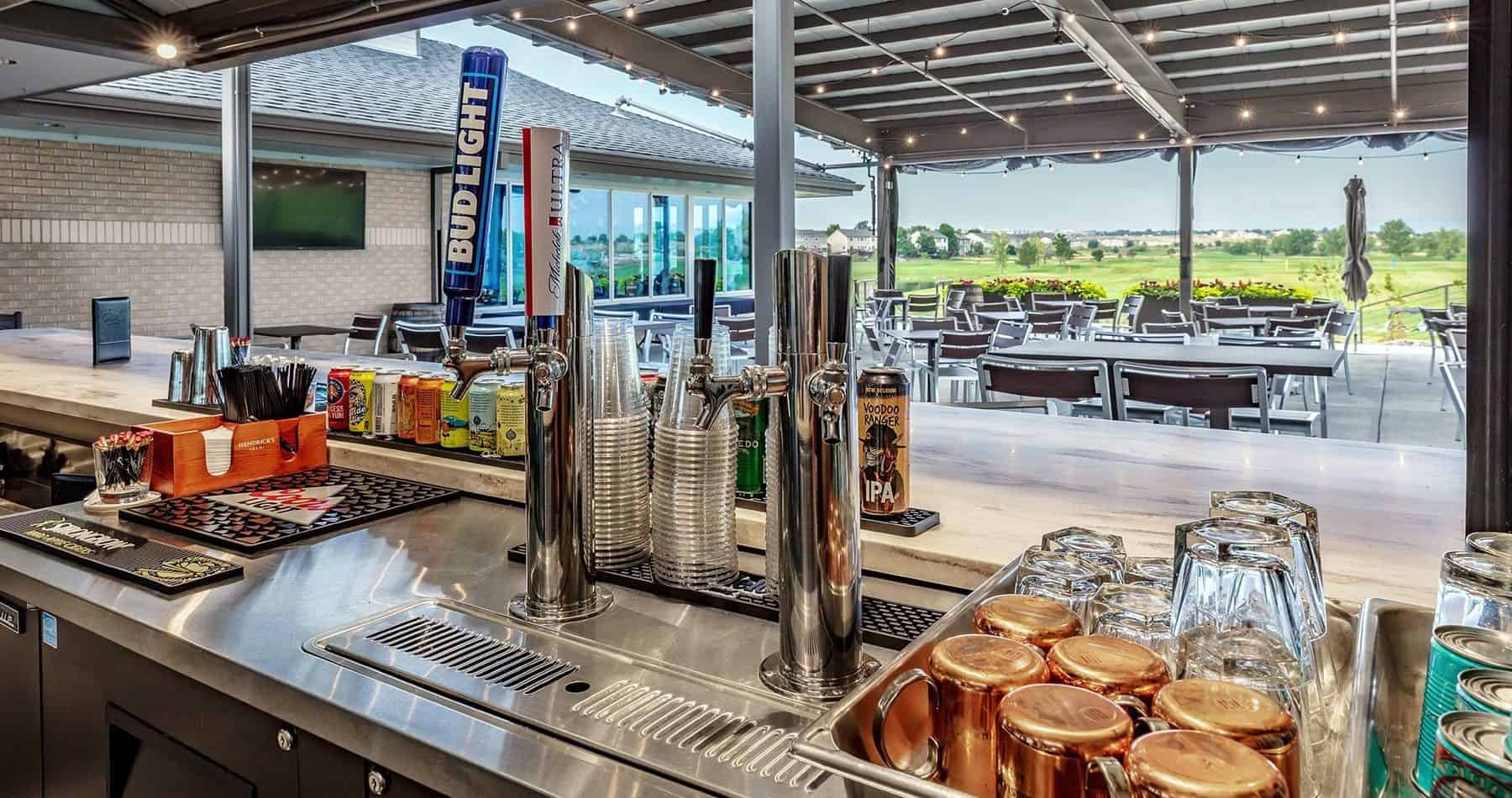 The outdoor covered bar area with multiple beers on tap